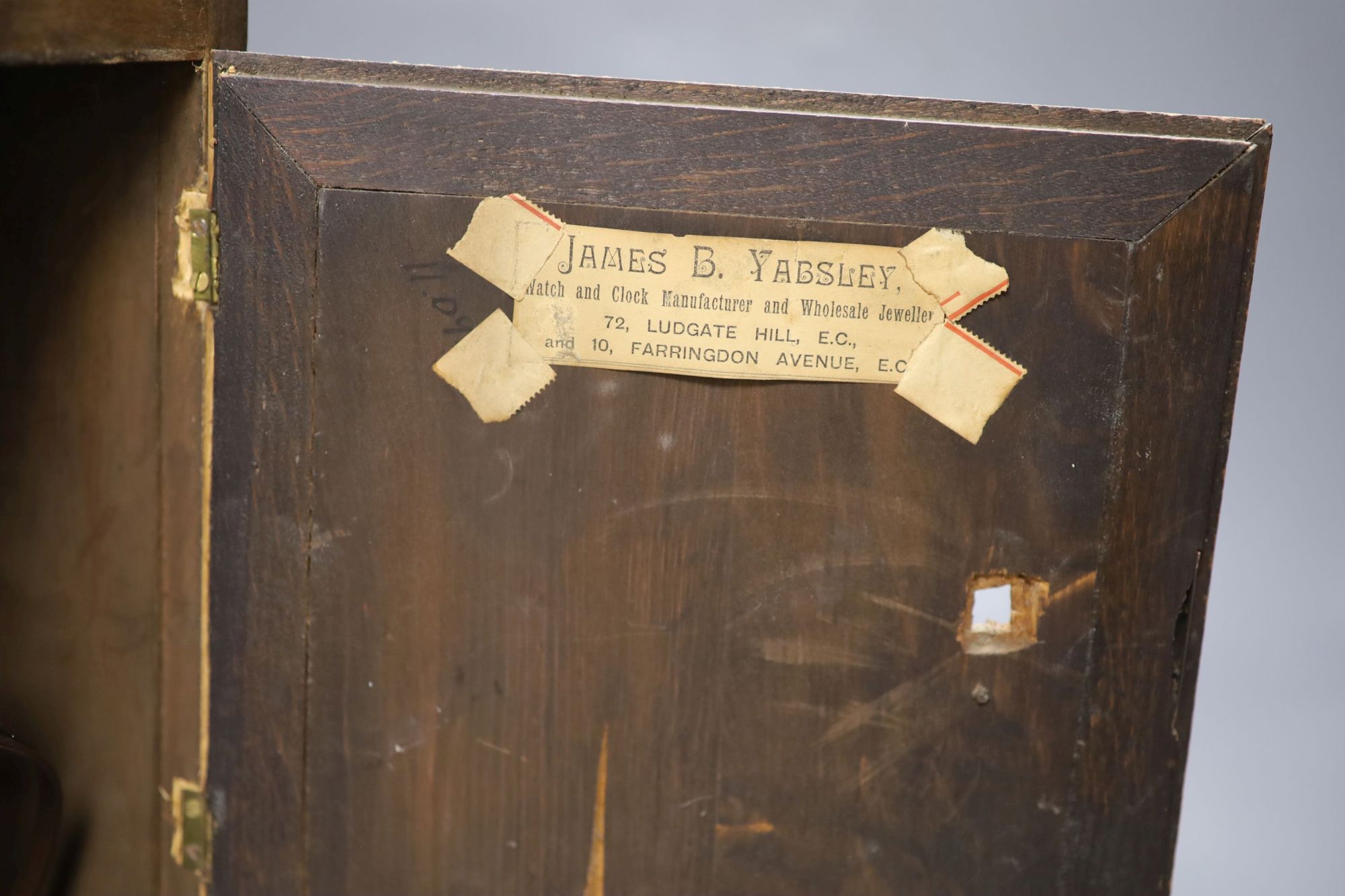 A German walnut mantel clock, converted to electric regulation, height 44cm